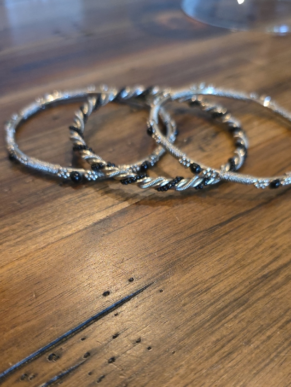 Set Of 3 Silver Toned Bangle Braclets With Black Accents